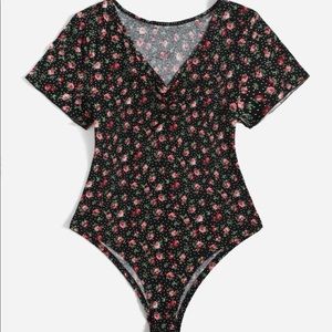 Plus size floral ruched front bodysuit.